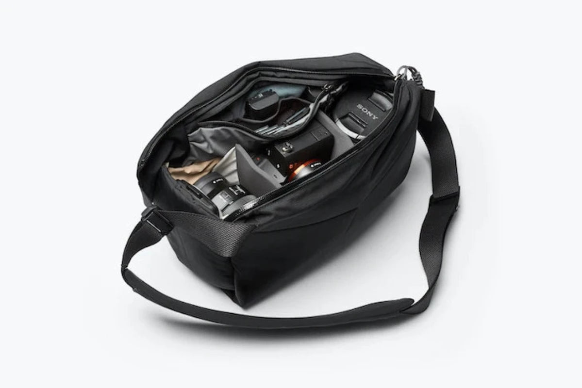 Bellroy Venture Sling Camera Edition in Midnight open showing contents in the bag