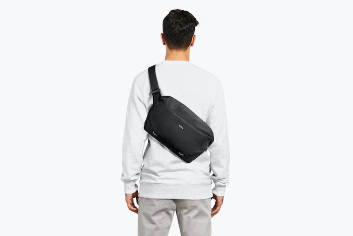Bellroy Venture Sling Camera Edition in Midnight  showing a model carrying bag on shoulder