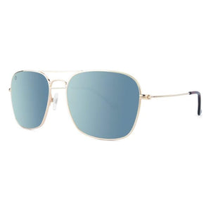 Mount Evans sunglasses in gold with sky blue lenses, angled view, The Simple Man