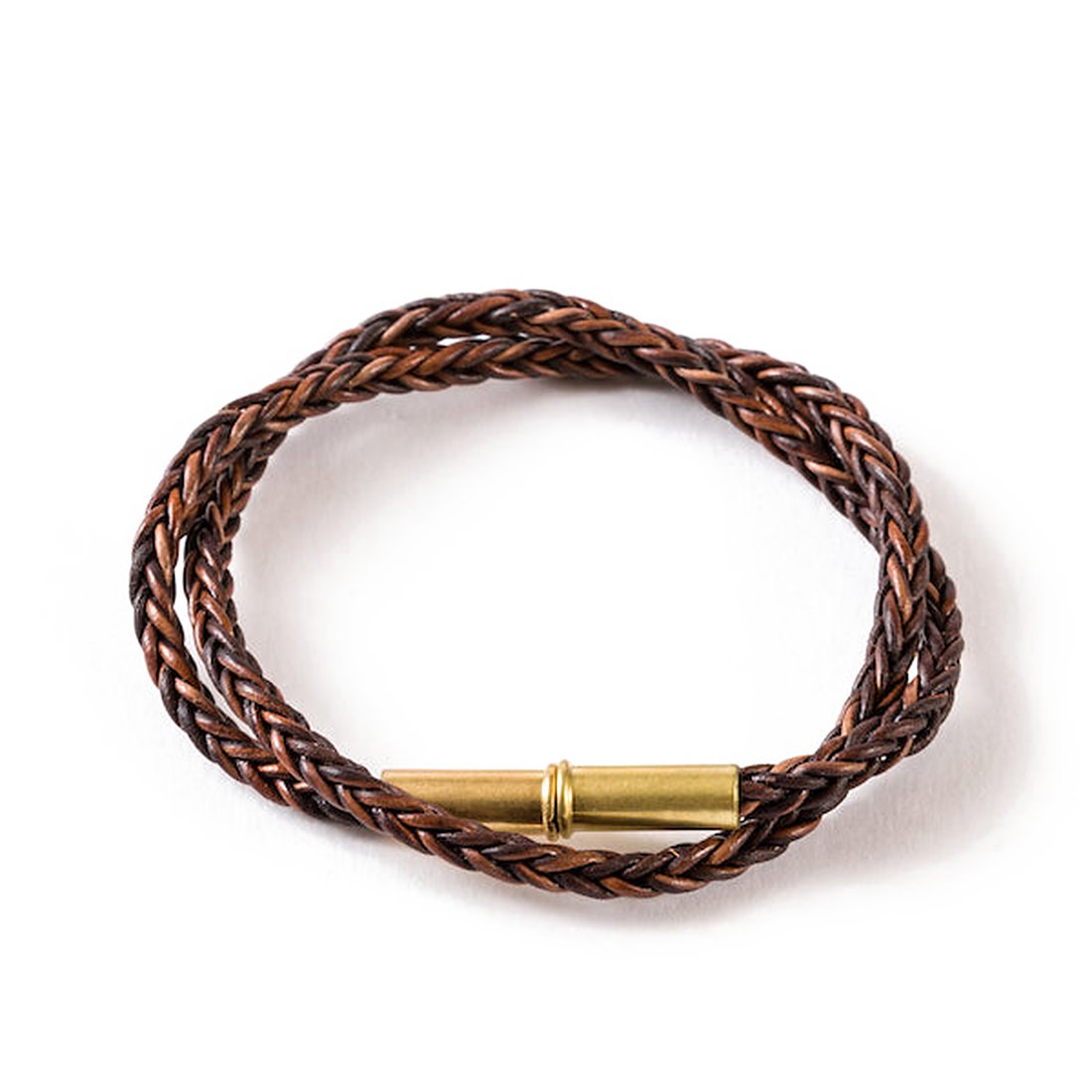 Flint braided leather bracelet in dark brown with a brass .22 shell magnetic closure, on a white background