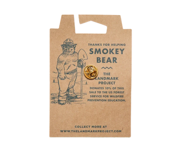Back of the kraft backing card for the Smokey Bear enamel pin