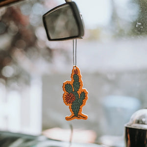 Good & Feel supply Co Zion Car Air Freshener Hanging from a car mirror